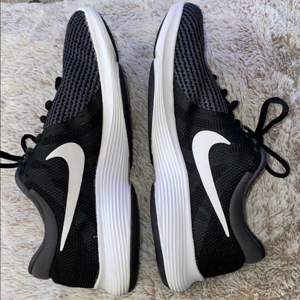 2/$50 Nike sneakers. Black with white Nike symbol.